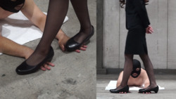 C-01) 穿着西装的女人用高跟鞋践踏她的赤手。