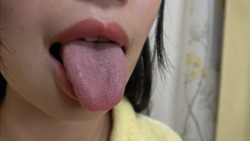A girl with a frown and a girl with a cute but ugly face. Lips, tongue, saliva and finger sucking...